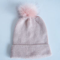 pink acrylic hat with fake fur pompom