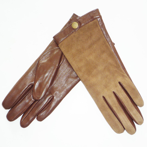 glove with a metal button on cuff