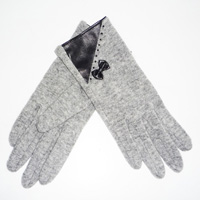 grey glove with a bow